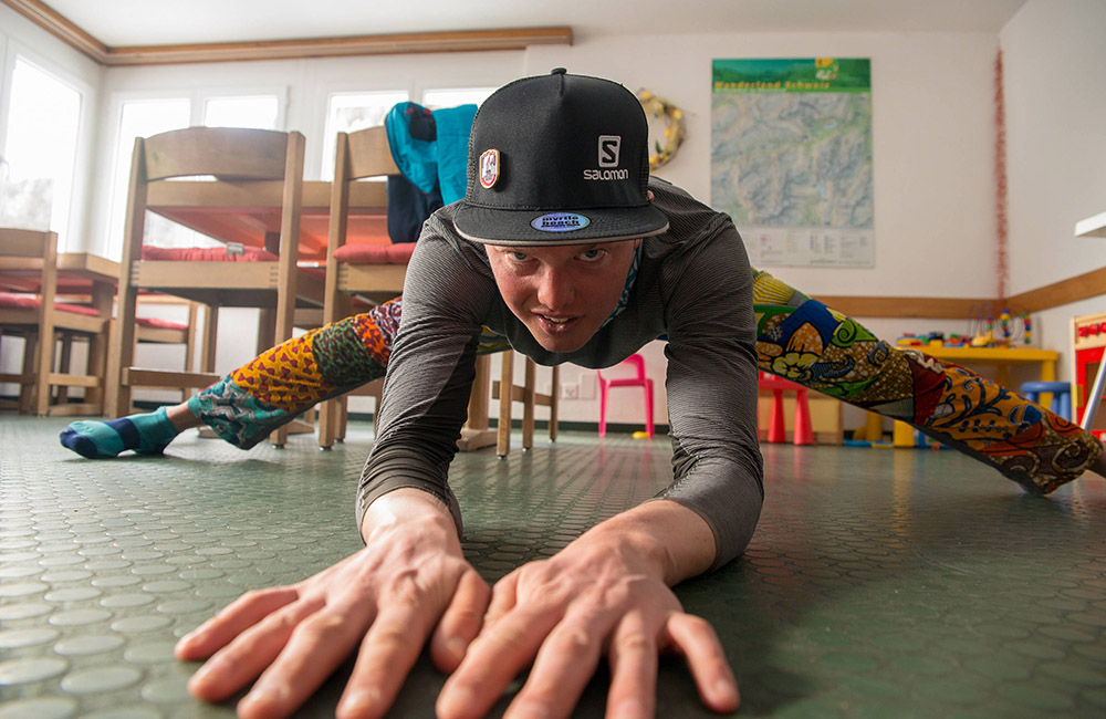 Philipp Reiter doing some stretching after a long skitour day. (image: Christian Gamsjäger / Red Bull Content Pool)